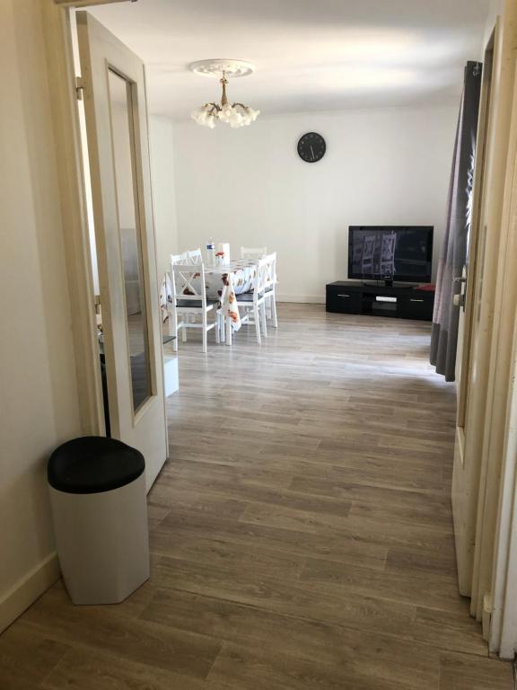 a hallway with a living room and a dining room at 02 Bedrooms-Paris-Disneyland-WiFi- Parking-RER A in Noisy-le-Grand