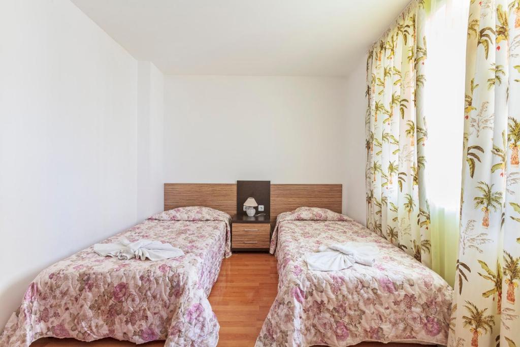 Postel nebo postele na pokoji v ubytování Guest Apartments Co Morenia