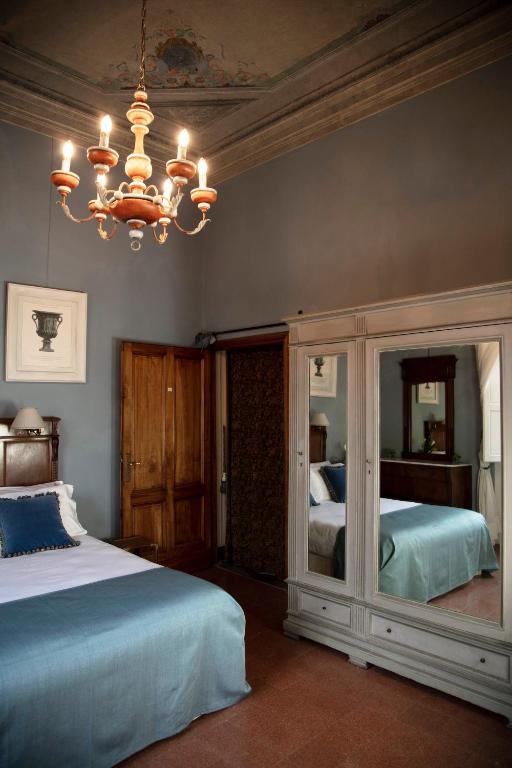 Postel nebo postele na pokoji v ubytování Hotel Palazzo Guadagni