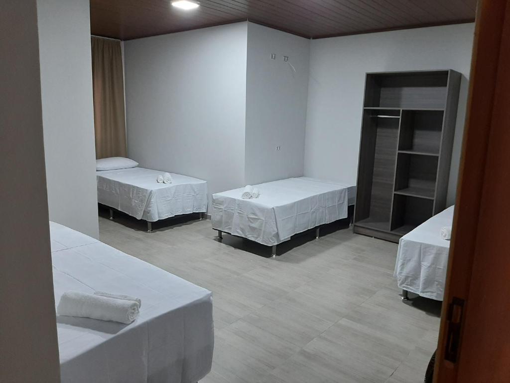 Postel nebo postele na pokoji v ubytování Hotel ROF