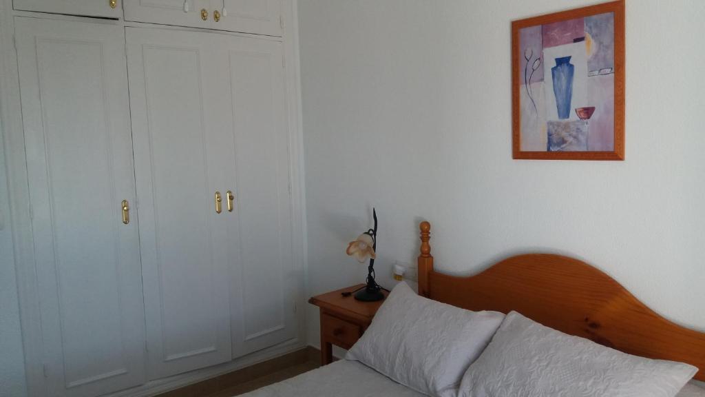 Łóżko lub łóżka w pokoju w obiekcie Primera linea de playa "Barrosamar"