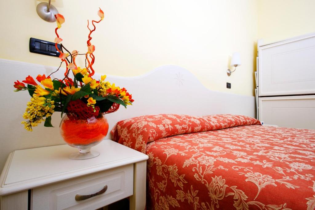 Postel nebo postele na pokoji v ubytování Hotel Baia