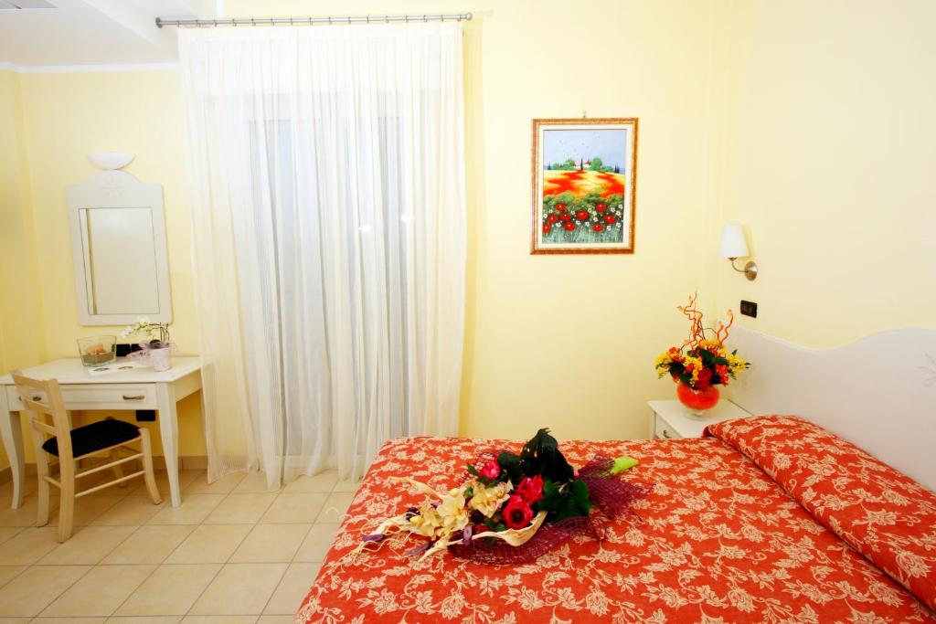 Postel nebo postele na pokoji v ubytování Hotel Baia