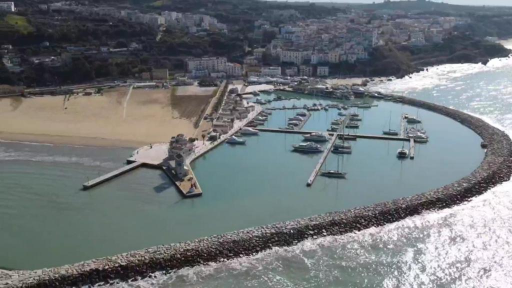 an aerial view of a marina with boats in the water at La casa del corso in Rodi Garganico