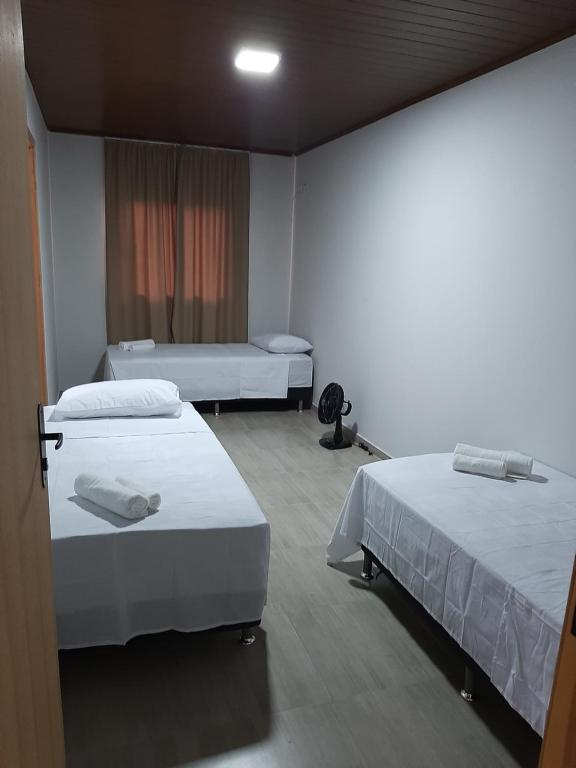 Postel nebo postele na pokoji v ubytování Hotel ROF