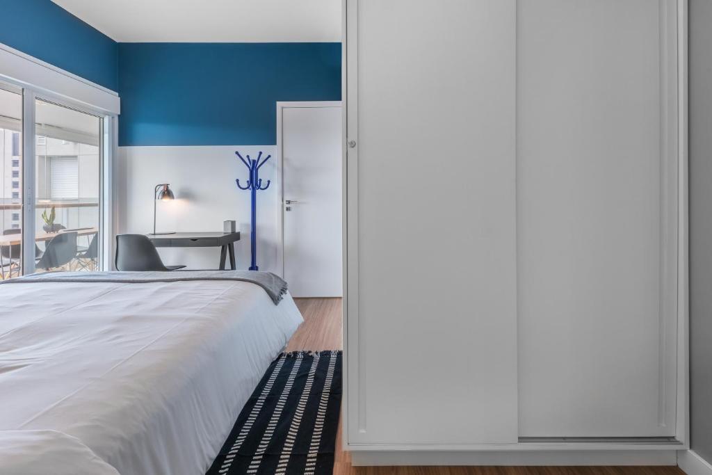 Cama ou camas em um quarto em Charlie One Eleven Vila Olímpia