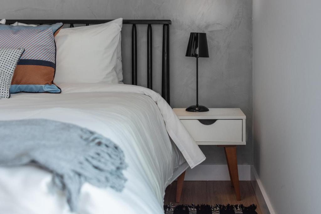 Cama ou camas em um quarto em Charlie One Eleven Vila Olímpia