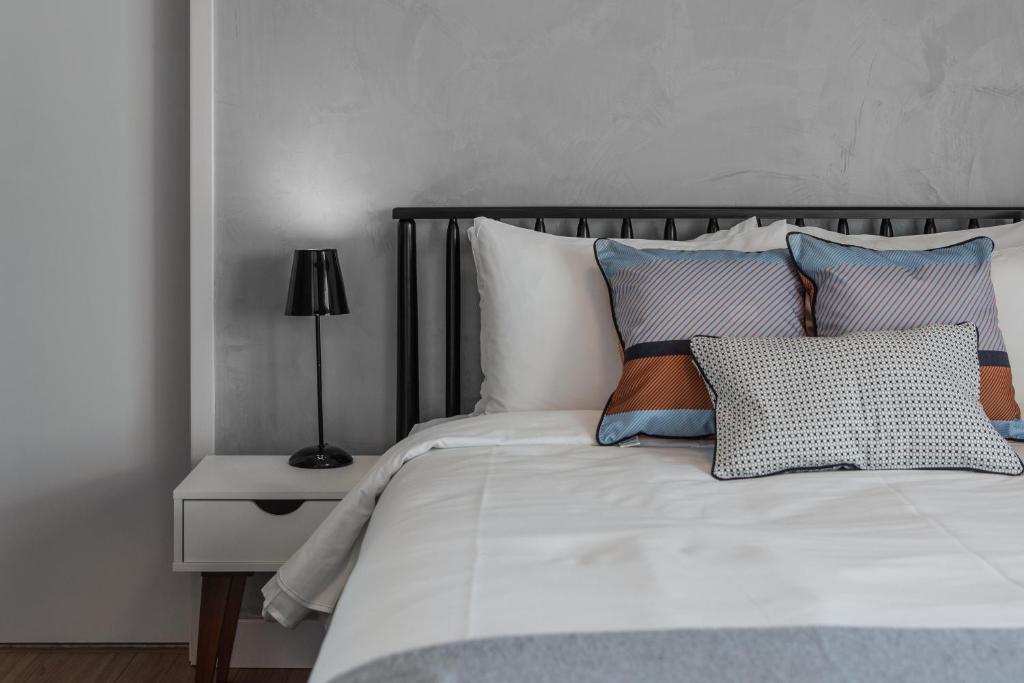 Cama ou camas em um quarto em Charlie One Eleven Vila Olímpia