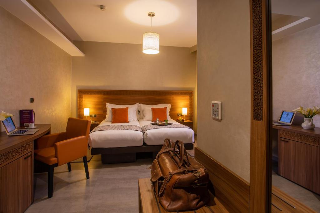 Postel nebo postele na pokoji v ubytování Dellarosa Boutique Hotel and Spa
