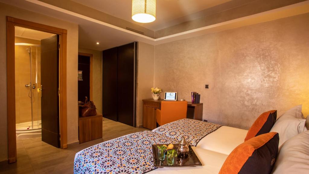 Postel nebo postele na pokoji v ubytování Dellarosa Boutique Hotel and Spa