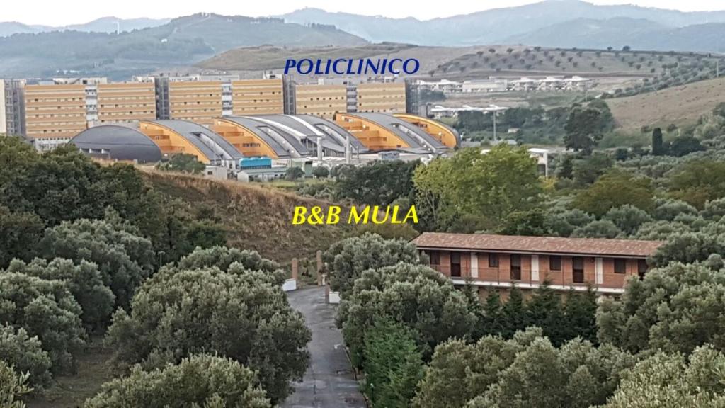 a view of a city with buildings and trees at B&b Mula Germaneto in Santa Maria