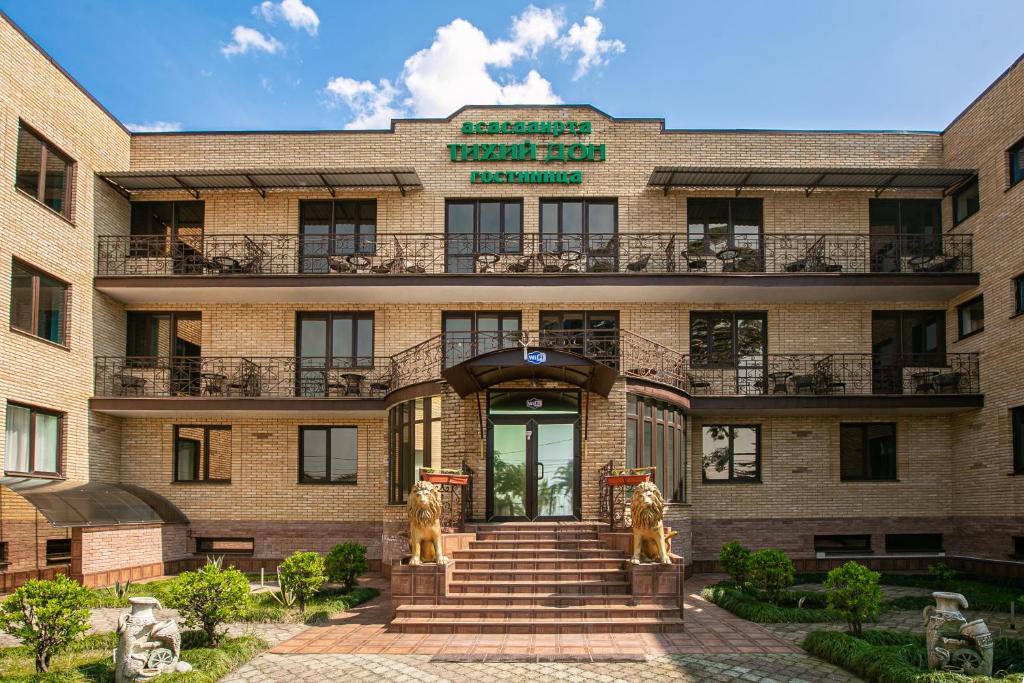 a building with two lions in front of it at Тихий Дон in Gagra