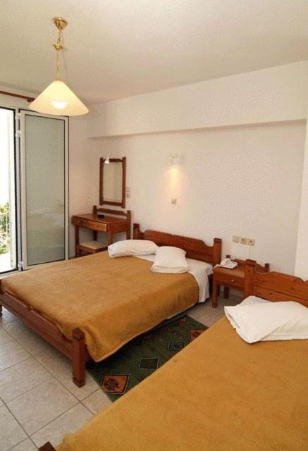 Postel nebo postele na pokoji v ubytování Hotel Orfeas