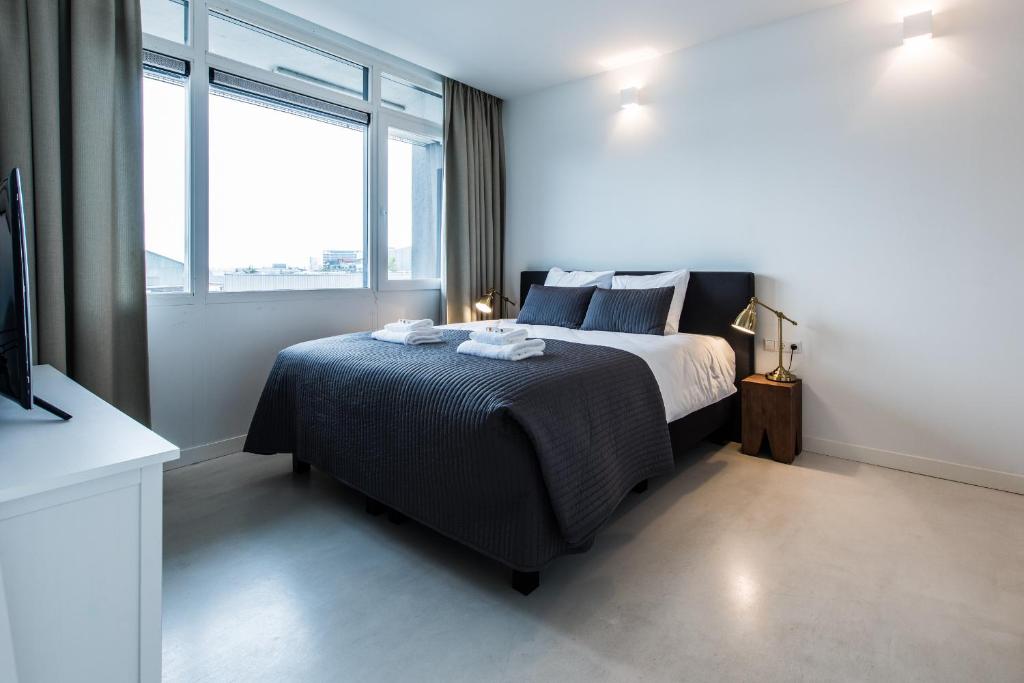 Postel nebo postele na pokoji v ubytování Houthavens Apartments