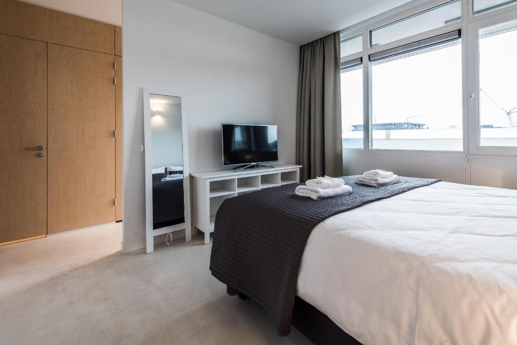 Postel nebo postele na pokoji v ubytování Houthavens Apartments