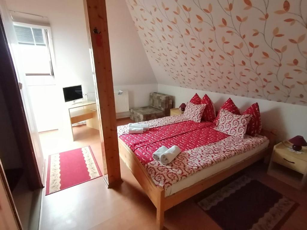 Postel nebo postele na pokoji v ubytování Joós Apartman
