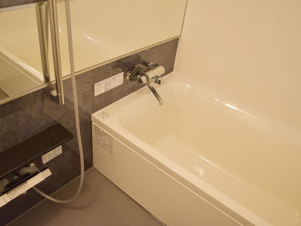Koupelna v ubytování UMEDAHOLIC HOTEL