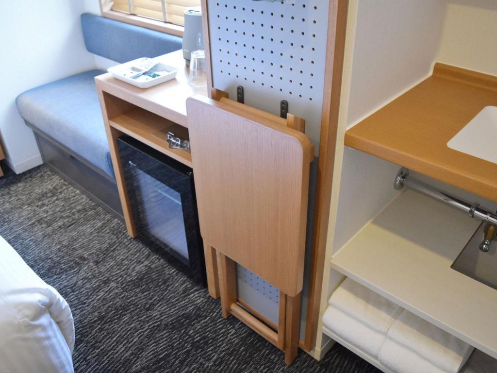 Kuchyň nebo kuchyňský kout v ubytování UMEDAHOLIC HOTEL