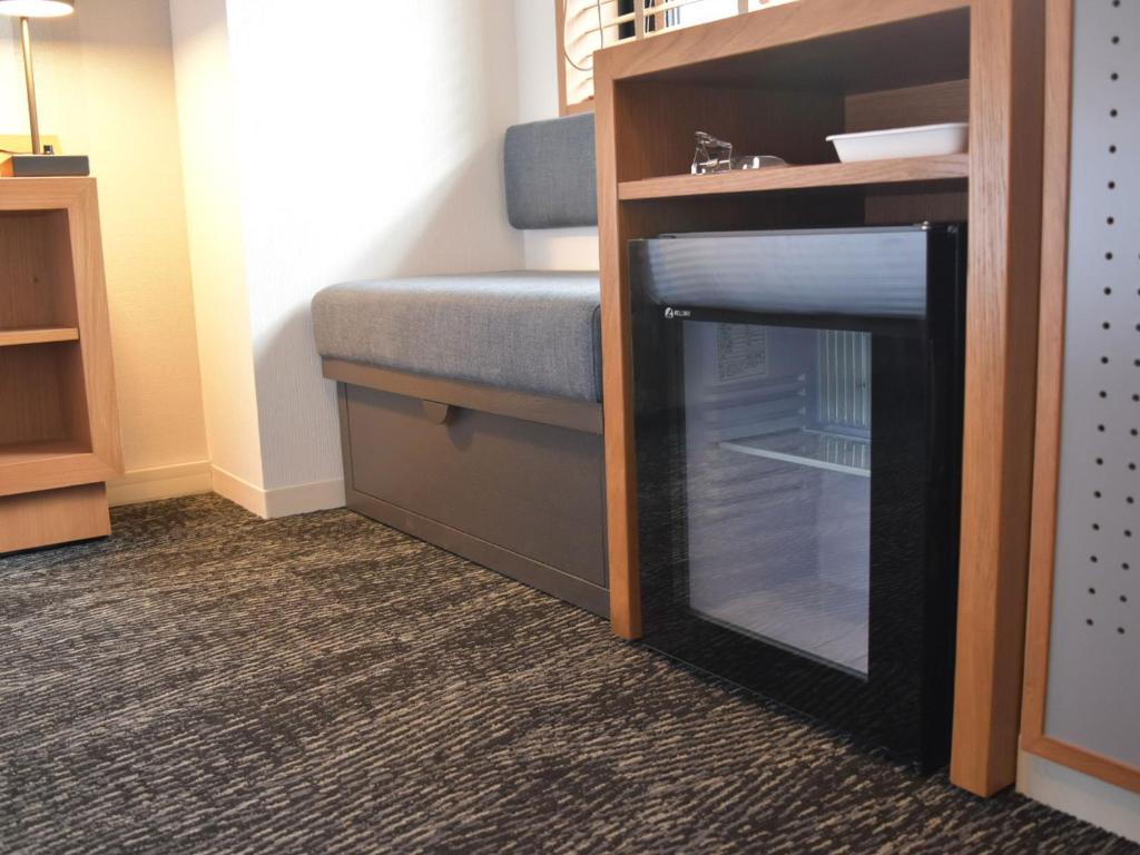 Postel nebo postele na pokoji v ubytování UMEDAHOLIC HOTEL