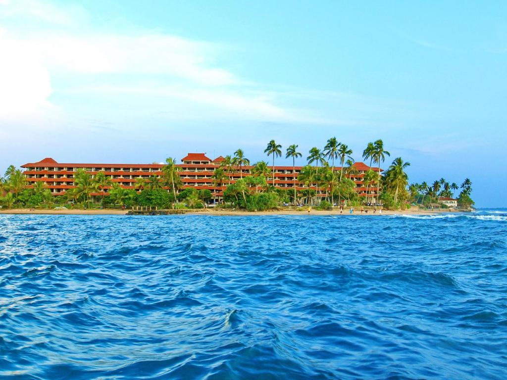 a view of the resort from the water at Hikka Tranz by Cinnamon in Hikkaduwa
