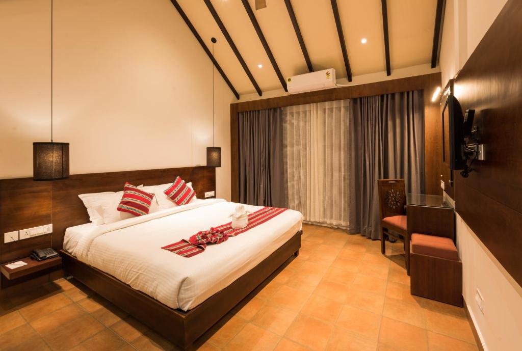 Postel nebo postele na pokoji v ubytování Trivers Resort Munnar