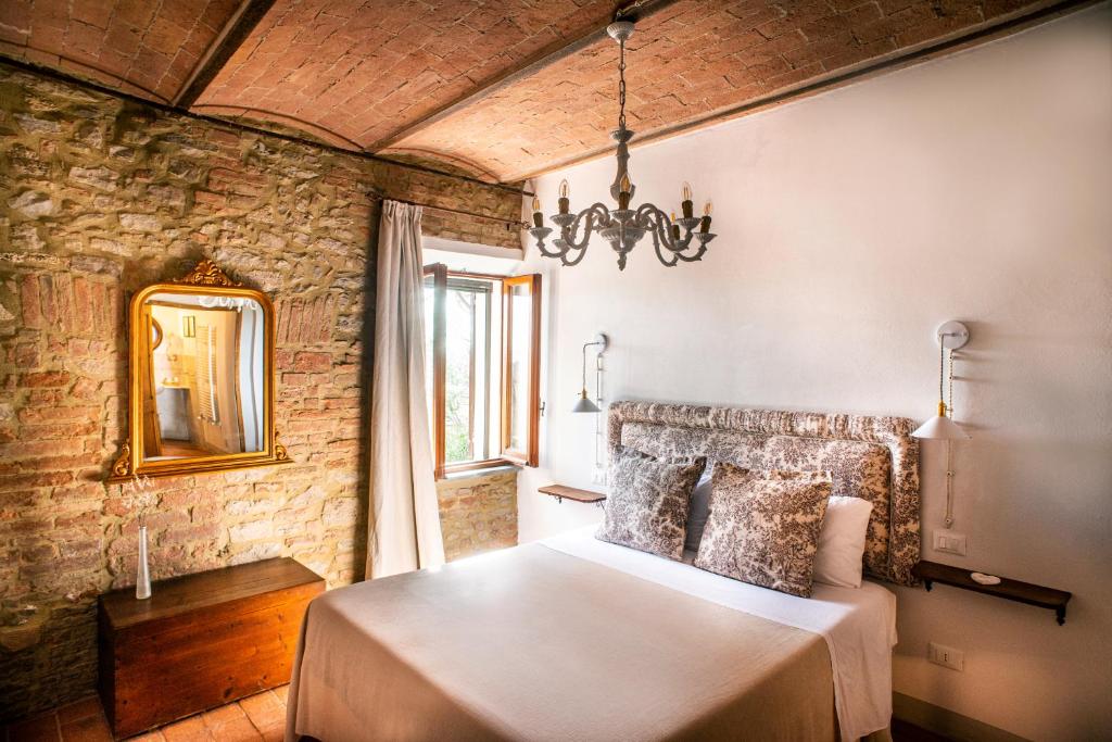 Postel nebo postele na pokoji v ubytování Agriturismo Pieve Sprenna