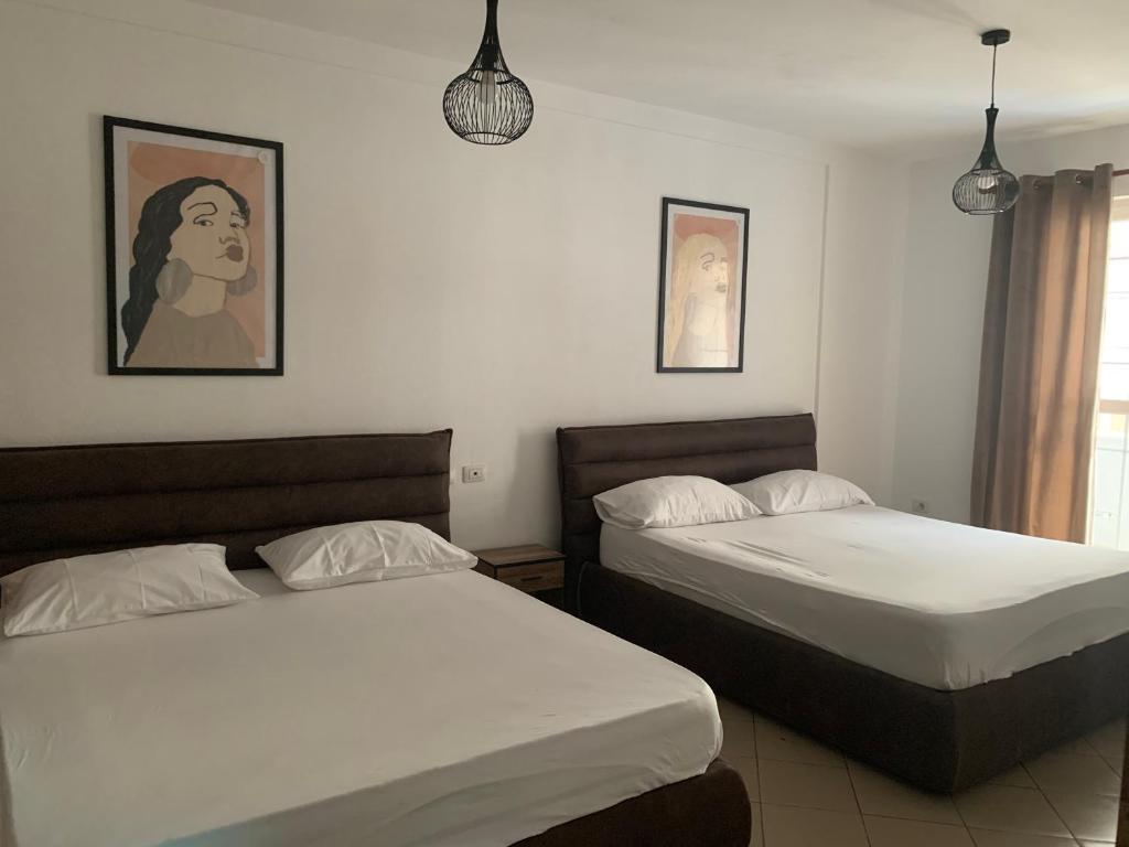 A bed or beds in a room at Guest House Ondine