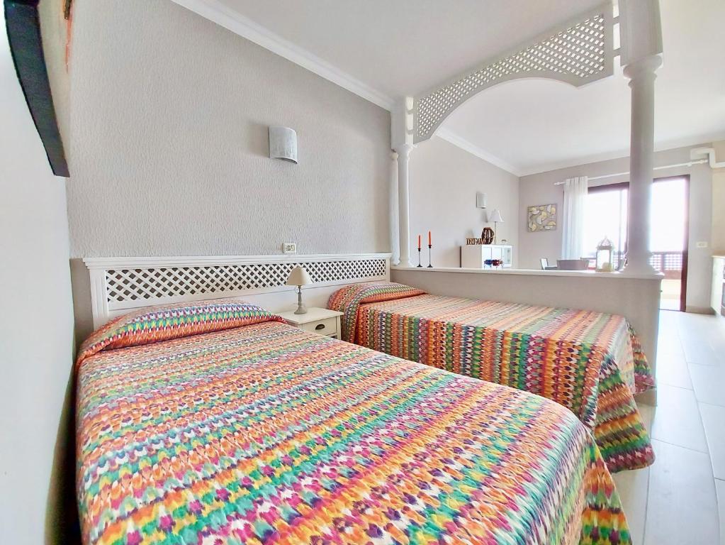 Posteľ alebo postele v izbe v ubytovaní Ocean and Sun Studio Apartment