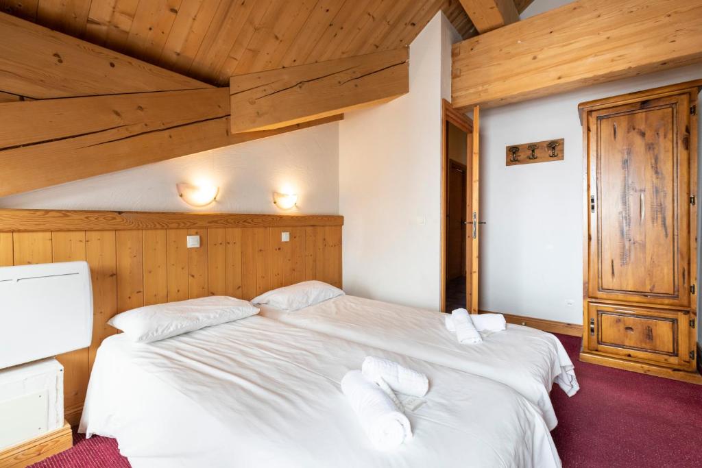 Postel nebo postele na pokoji v ubytování Chalet des Neiges Plein Sud