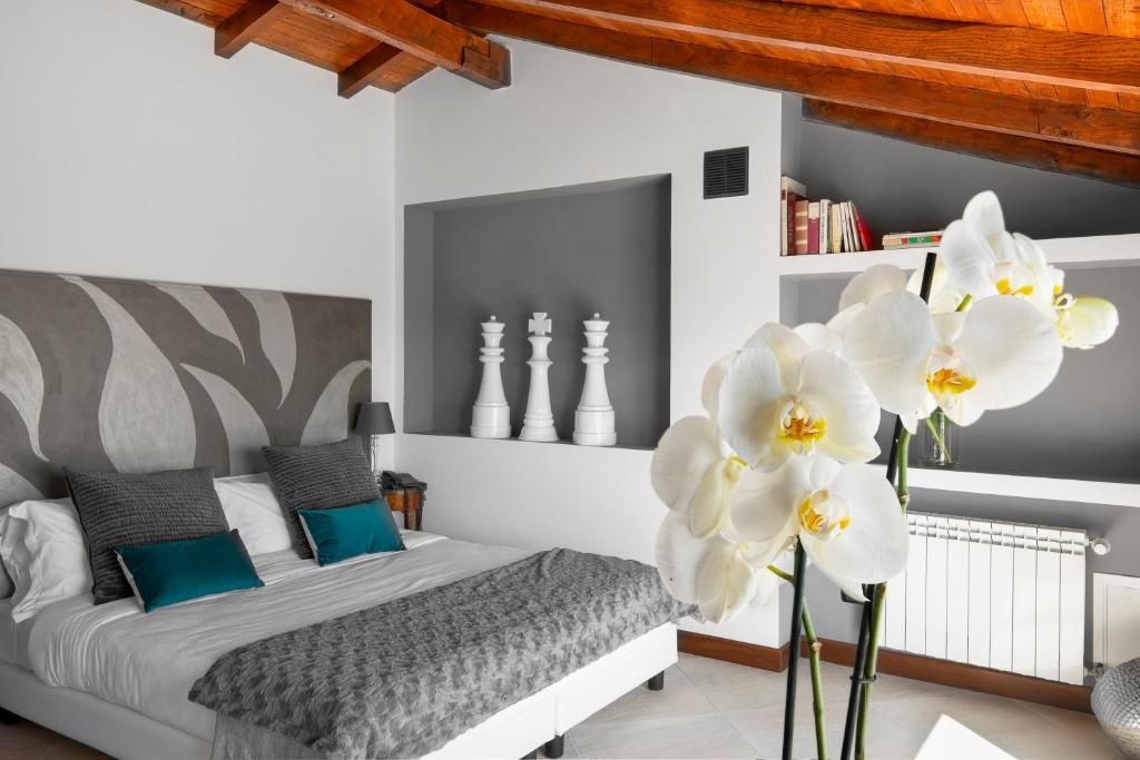 Łóżko lub łóżka w pokoju w obiekcie La Locanda Del Pontefice - Luxury Country House