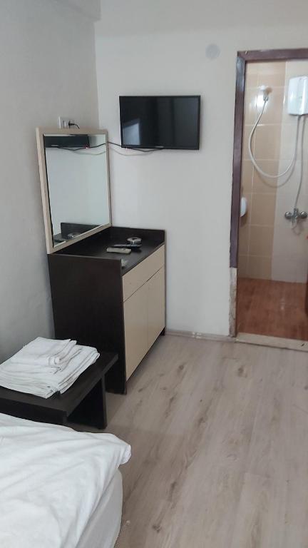 Postel nebo postele na pokoji v ubytování Dilmac Hotel