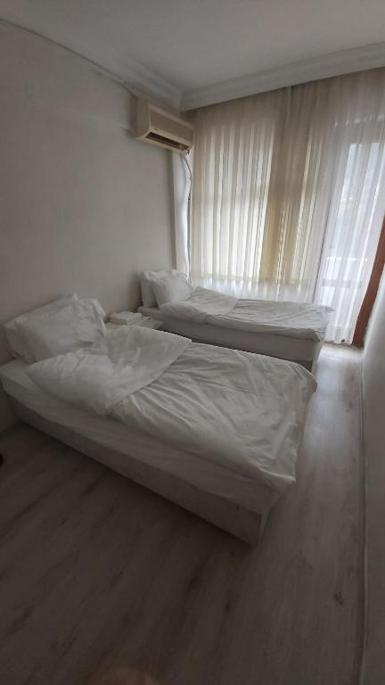 Postel nebo postele na pokoji v ubytování Dilmac Hotel