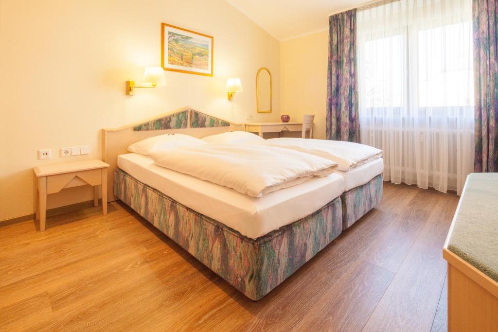 Postel nebo postele na pokoji v ubytování Ringhotel Reubel