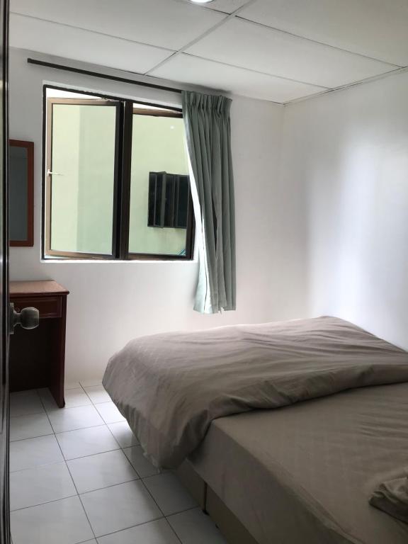 Postel nebo postele na pokoji v ubytování Pangkor Coralbay Resort 201 apartment
