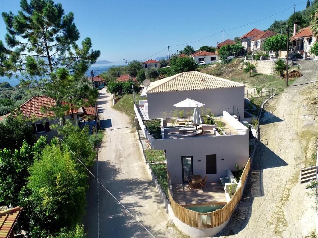 an aerial view of a house with a patio at Elsa Luxury Apartments in Paleros