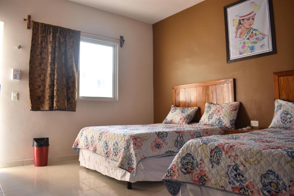 Postel nebo postele na pokoji v ubytování Hotel D’Cural
