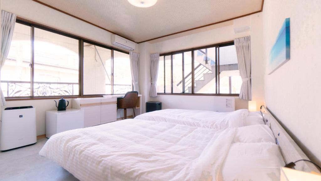 Postel nebo postele na pokoji v ubytování VOYAN Resort Fujiyamanakako Gekkoso