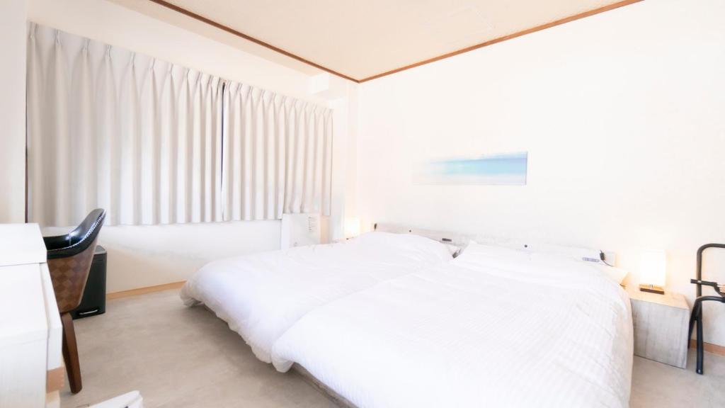 Postel nebo postele na pokoji v ubytování VOYAN Resort Fujiyamanakako Gekkoso