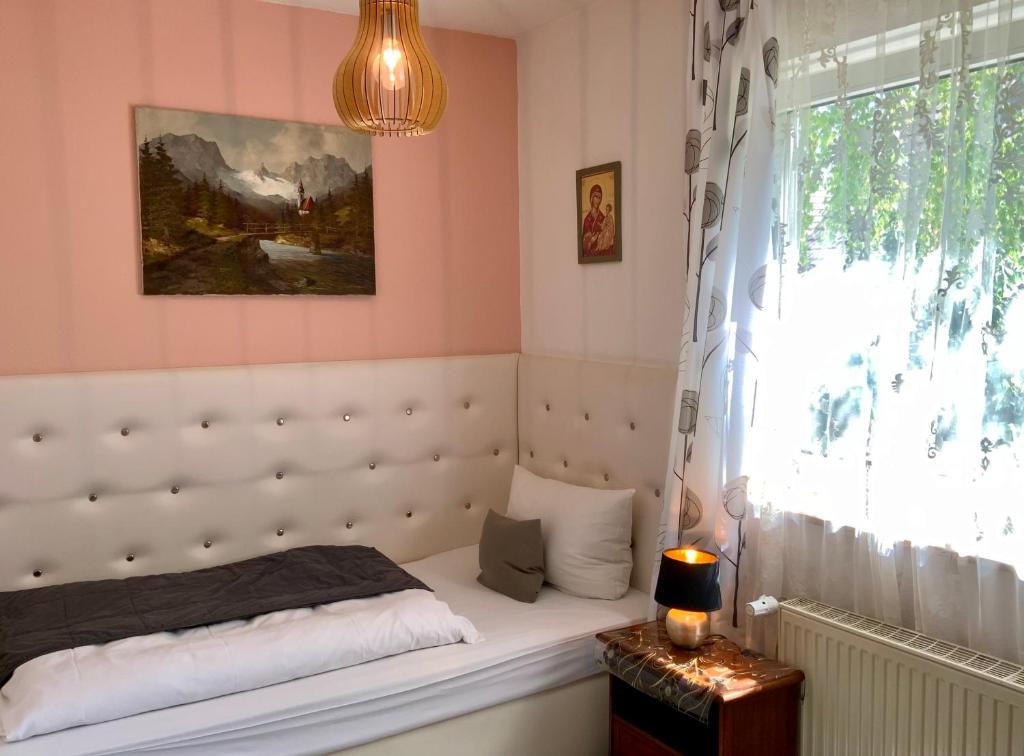 Postel nebo postele na pokoji v ubytování Hotel Attaché