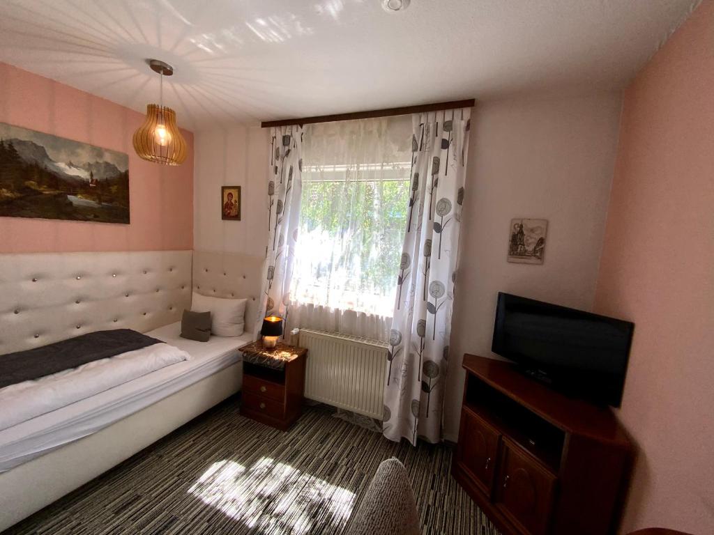 Postel nebo postele na pokoji v ubytování Hotel Attaché