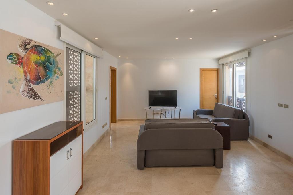 TV a/nebo společenská místnost v ubytování VESTA - El Gouna Residence