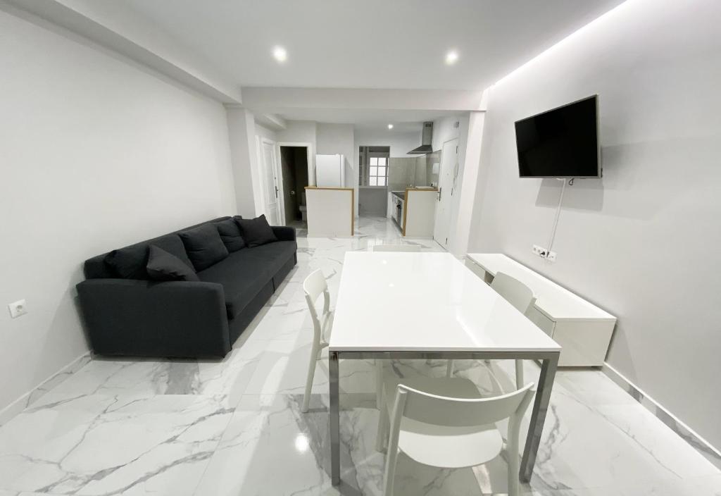 Televízia a/alebo spoločenská miestnosť v ubytovaní Apartamento San Félix, Playa La Caleta