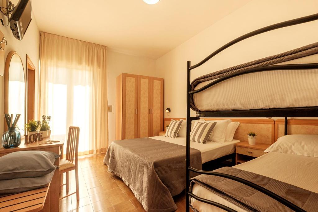 Postel nebo postele na pokoji v ubytování Hotel Oceanic