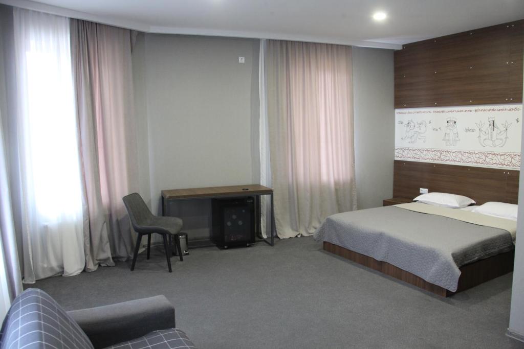 Postel nebo postele na pokoji v ubytování Hotel History • სასტუმრო ისტორია