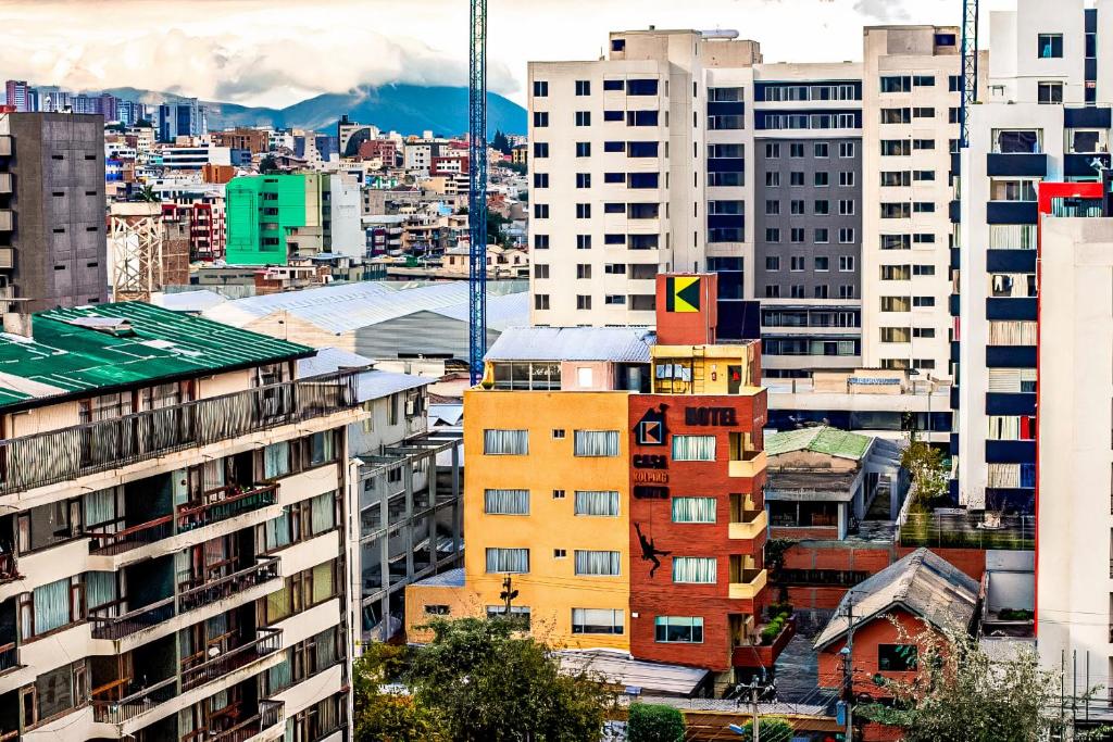 a view of a city with tall buildings at Hotel Casa Kolping Quito in Quito