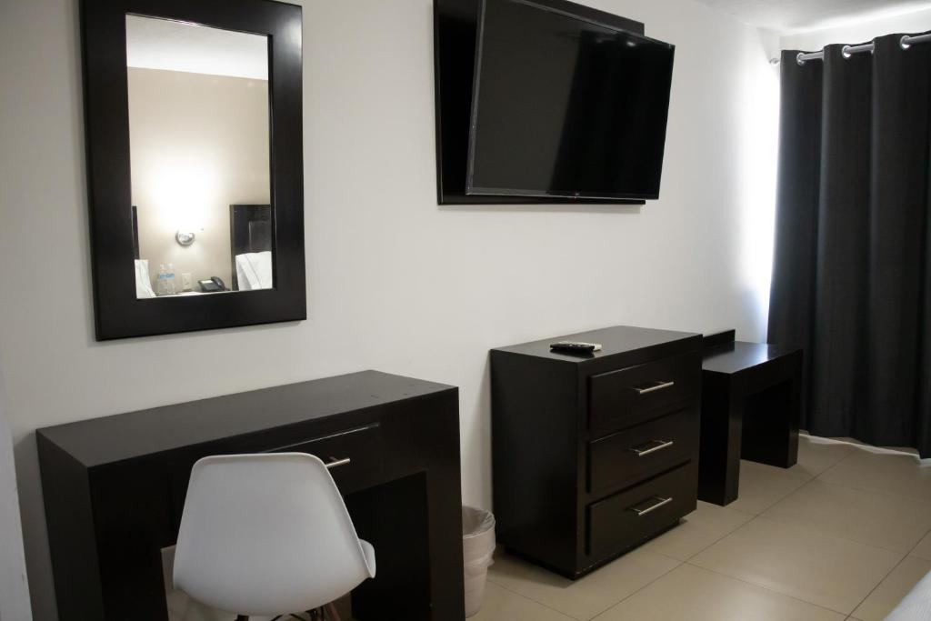 TV a/nebo společenská místnost v ubytování Hotel Las Pergolas