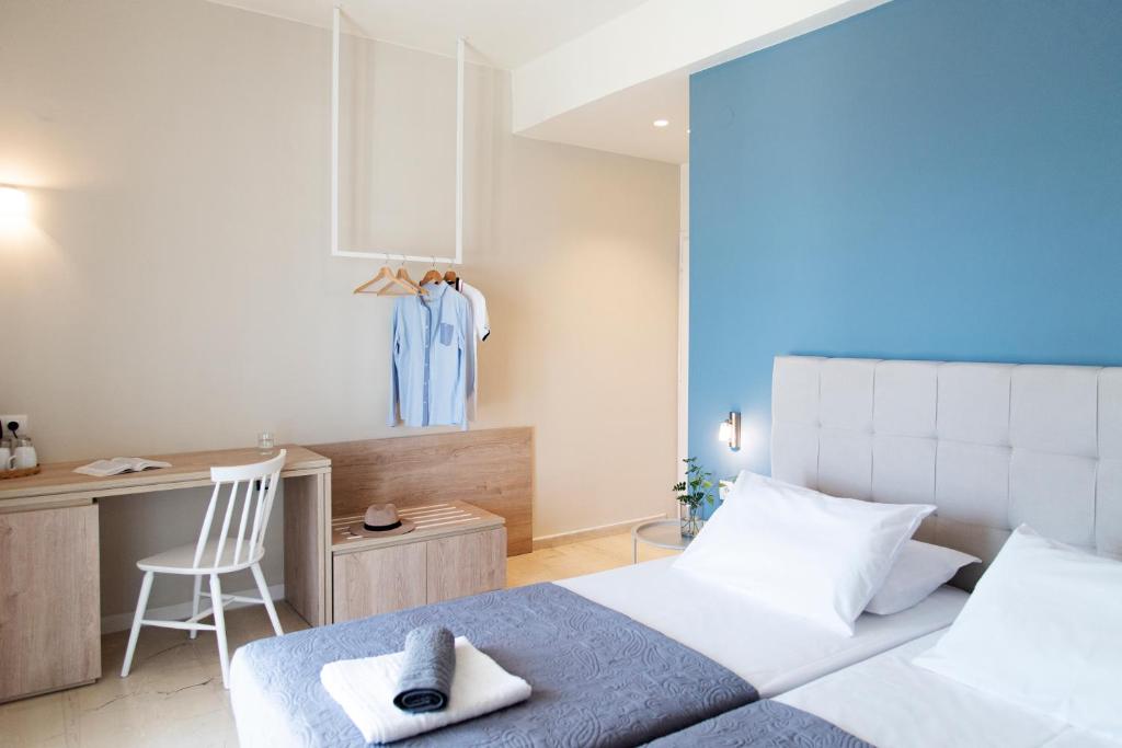 Postel nebo postele na pokoji v ubytování Ammos Apartments