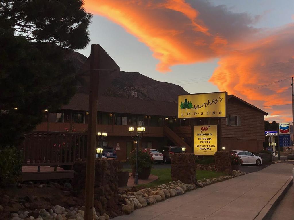 a sign in front of a building with a mountain at Murphey's Motel LLC in Lee Vining