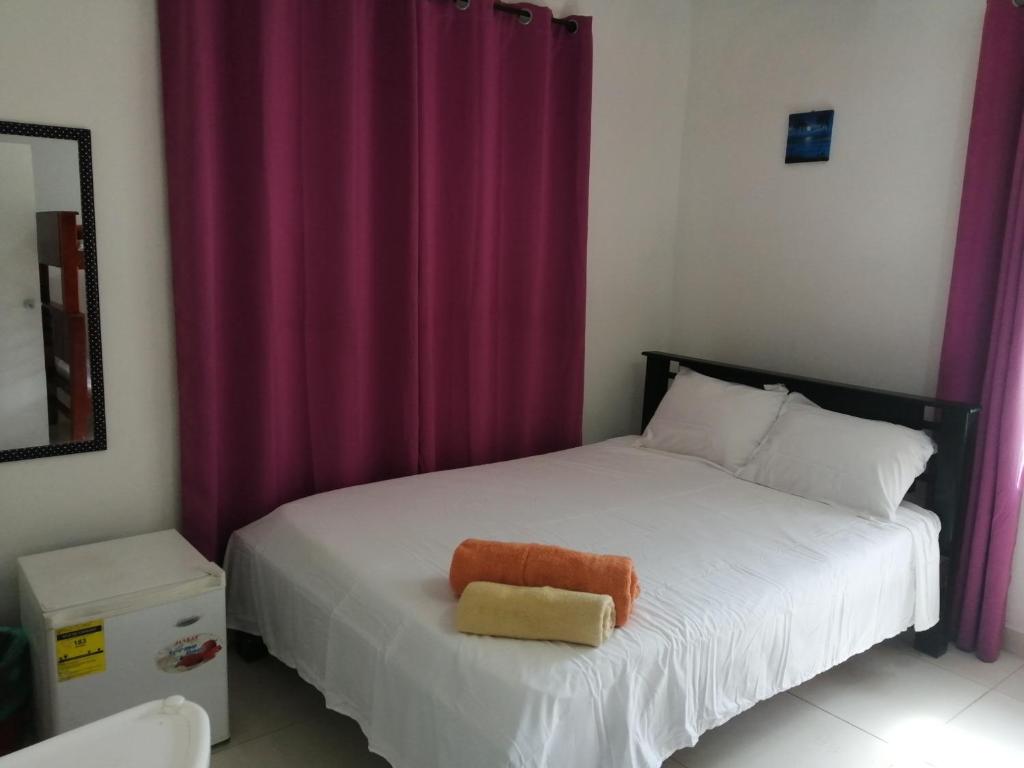 Postel nebo postele na pokoji v ubytování Inn Skyline Hostel