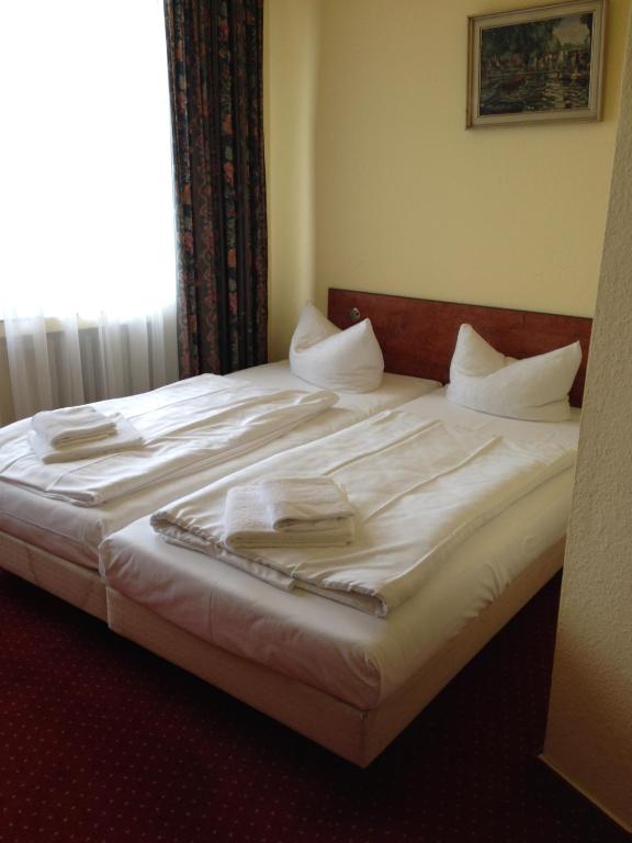 Postel nebo postele na pokoji v ubytování Domo Hotel Mondial